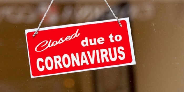red sign that says closed due to coronavirus