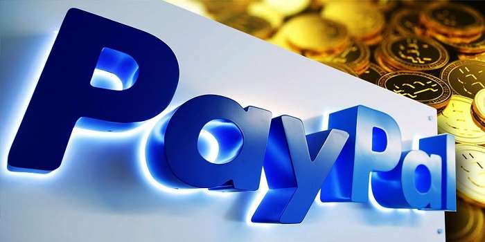 paypal sign in front of gold bitcoin tokens