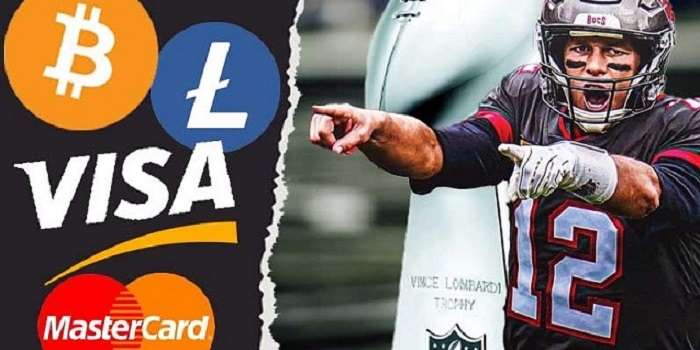 tom brady in buccaneers uniform pointing at bitcoin, litecoin, visa, mastercard logos