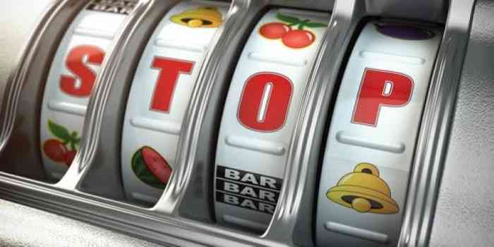 slot machine saying stop for gambling addiction